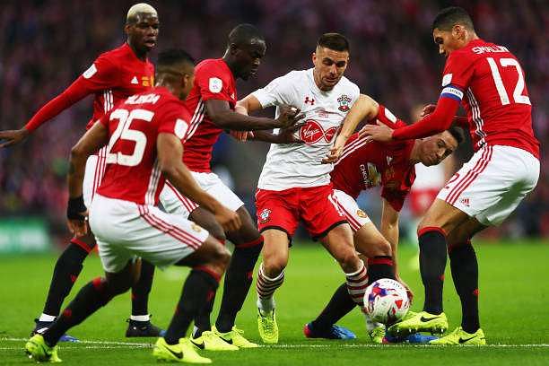 LONDON, ENGLAND - FEBRUARY 26:  Dusan Tadic of Southampton is surrounded by the Manchester United defence during the EFL Cup Final match between Manchester United and Southampton at Wembley Stadium on February 26, 2017 in London, England.  (Photo by Michael Steele/Getty Images)